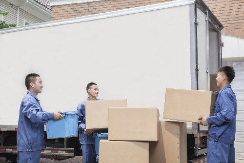 Furniture and boxes being loaded into a removal truck in West London