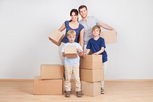 Packed office boxes and furniture ready for a Hammersmith move