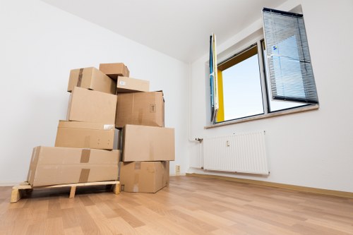 Local moving team handling boxes near a Hammersmith flat