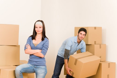 Local removal team packing household items for a West London move
