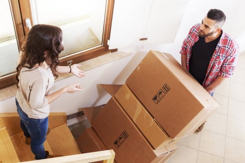 Commercial movers loading items for a west London business relocation