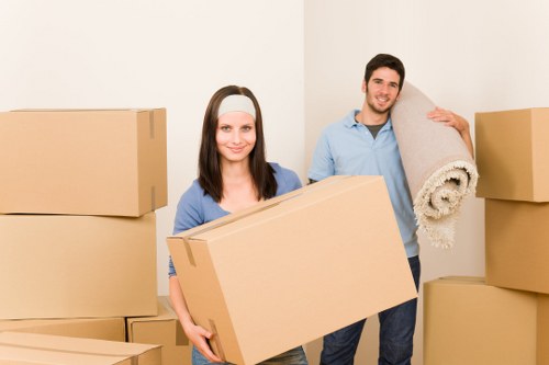 Packed boxes and moving equipment prepared for a Hammersmith property move