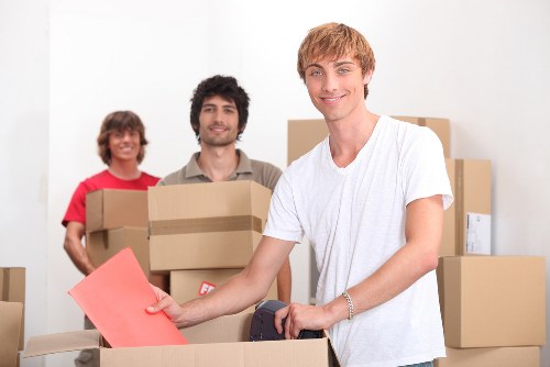 Packed household boxes and furniture ready for a home move in Hammersmith