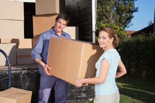 Local moving team loading furniture into a truck in Hammersmith